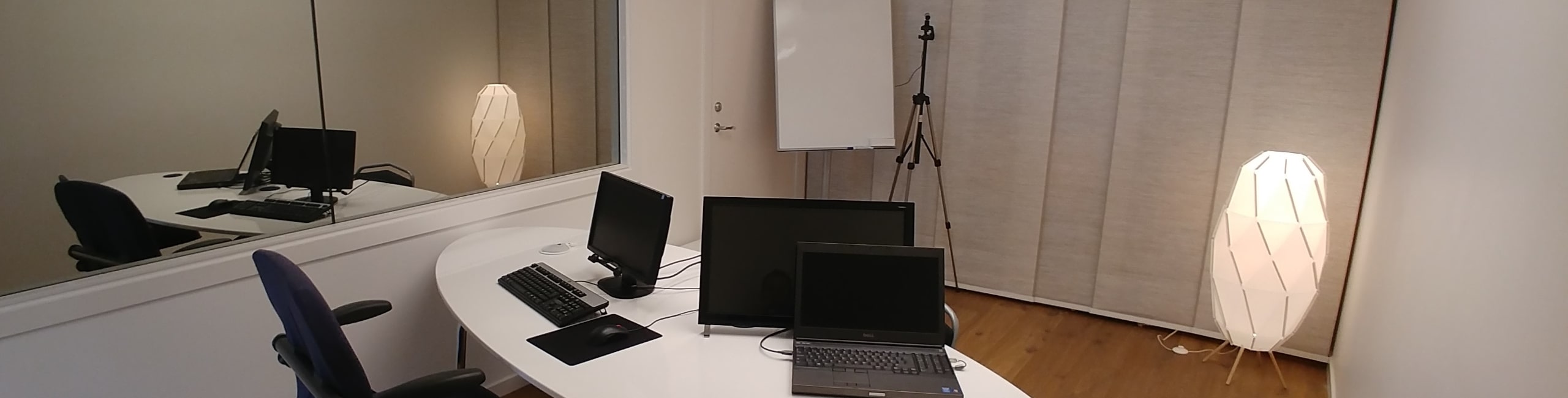 Picture of big test room with one-way mirror in background